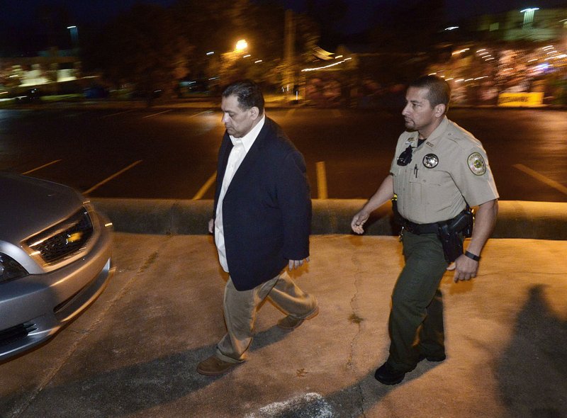 NWA Democrat-Gazette/BEN GOFF @NWABENGOFF Mauricio Torres walks to a waiting car under escort from Benton County deputies on Monday while leaving the Benton County Courthouse Annex in Bentonville. Torres was found guilty Monday of capital murder and first-degree battery in the death of his 6-year-old son.