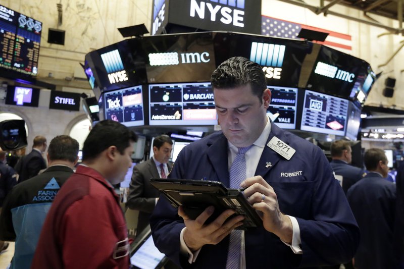 Trader Robert McQuade works on the floor of the New York Stock Exchange, Monday, Nov. 14, 2016. Stocks are opening modestly higher on Wall Street, led by gains in banks as interest rates continue to rise. 