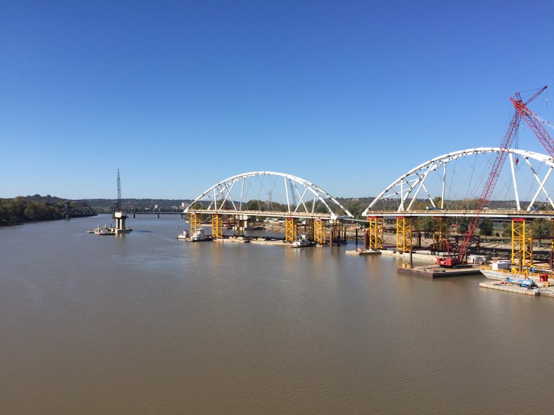 The new arch of the Broadway Bridge began being floated into place Tuesday about 12:30 p.m.