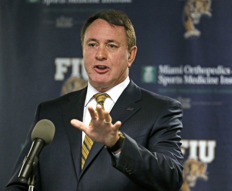 Butch Davis speaks after being named FIU head football coach Tuesday, Nov. 15, 2016 in Miami. 