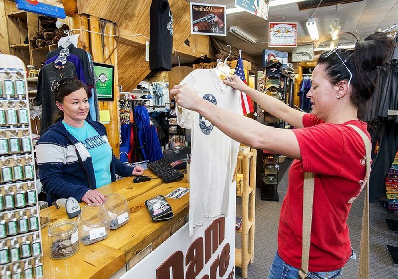 A customer at the Dam Store at the Big Thompson Canyon shops in Loveland, Colo., in this October file photo. 