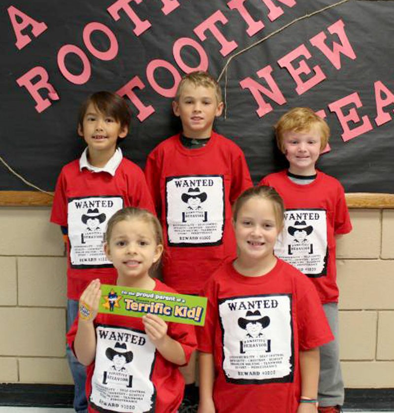 Photo by Zane Vanderpool PAWS Students of the Month at Glenn Duffy Elementary School are Luna Thornton of Gravette (front, left), Emma Ensor of Bella Vista, Hayden Heller of Bella Vista (back, left), Joseph Beem of Gravette and Asher Sisemore of Bentonville. Kailyn Deady of Gravette was not present at the time of the photo. PAWS award winners for November were honored at last week&#8217;s Rise and Shine assembly at the school.