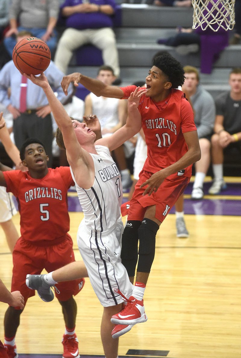 Tyler Roth (1) of Fayetteville has his shot blocked by Northside defender Isaiah Joe (10) on Tuesday at Fayetteville High School.