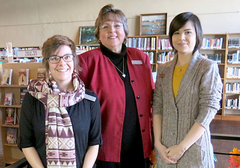Karen Benson (center), of Gravette, was recently chosen as interim supervisor at the Gravette Public Library. She is shown here with new library staff member Brittany Shreve and long-time employee Artemis Edmisten. Benson, who is working on a degree in journalism, had high praise for her staff and said she is excited about the new job and enjoying meeting the patrons. She invites all in the area to come in, get acquainted and learn about services the library offers. 