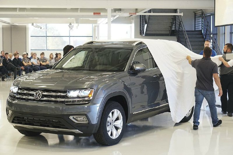 Employees at Volkswagen’s Chattanooga factory get a look at a new Volkswagen Atlas during a quarterly staff meeting Nov. 1. The vehicle will be produced at the facility in Tennessee. Factory output rose 0.2 percent in October, the Federal Reserve said Wednesday.