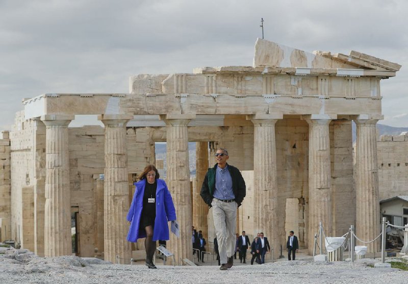 President Barack Obama tours the Acropolis, the ancient citadel in Athens, on Wednesday with Eleni Banou, antiquities director for the Greek ministry of culture. The site was closed while Obama walked the ruins.