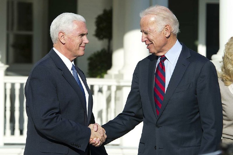 Vice President-elect Mike Pence (left) bids farewell to Vice President Joe Biden after a lunch meeting Wednesday at the Naval Observatory, the vice presidential residence in Washington.