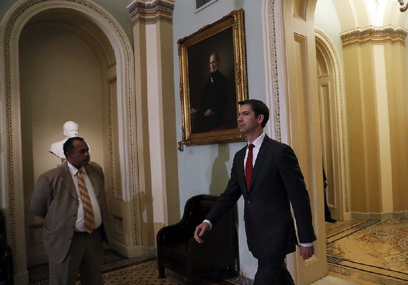 Sen. Tom Cotton, R-Ark., heads to a Senate GOP leadership election meeting Wednesday at the Capitol. Cotton “is all in for more defense spending,” said Sen. Lindsey Graham, R-S.C.