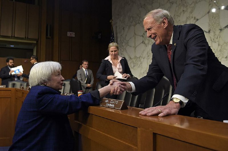 Federal Reserve Chairman Janet Yellen greets Joint Economic Committee Chairman Sen. Dan Coats, R-Ind., after her testimony Thursday on Capitol Hill in Washington.
