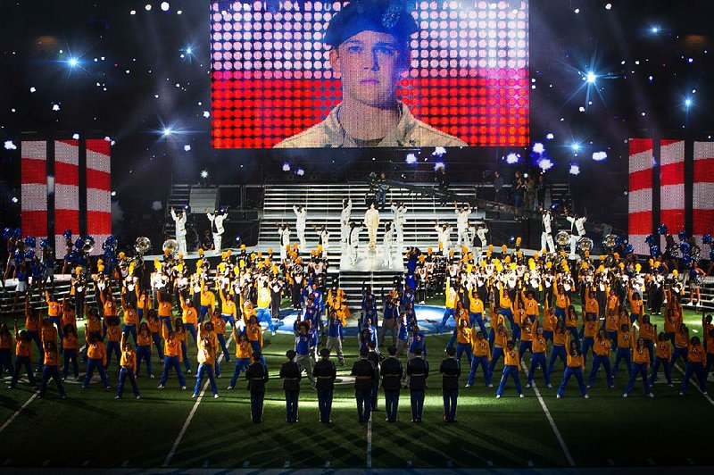 A group of Iraq War vets are honored during a surreal cerebration at a Dallas Cowboys football game in Ang Lee’s experimental drama Billy Lynn’s Long Halftime Walk.
