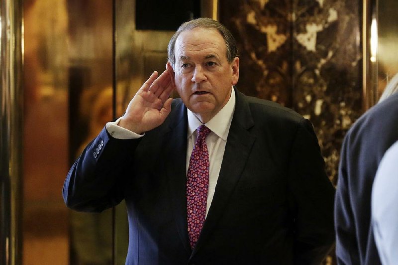 Former Arkansas Gov. Mike Huckabee heads into Trump Tower on Friday “for the Starbucks,” he said.