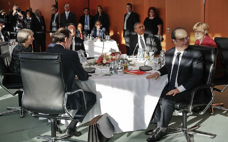 President Barack Obama meets with French President Francois Hollande, German Chancellor Angela Merkel and other European leaders Friday at the German Chancellery in Berlin.
