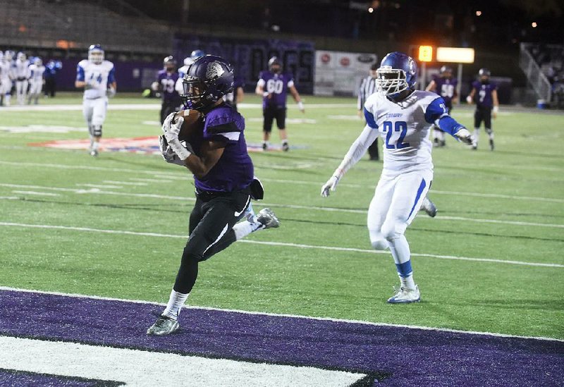Fayetteville receiver Terrance Rock pulls in a touchdown pass in front of Conway defender Nick Fletcher on Nov. 18 at Fayetteville High School.