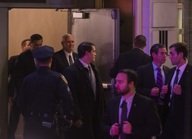 Vice President-elect Mike Pence, top center, leaves the Richard Rodgers Theatre after a performance of "Hamilton," in New York, Friday, Nov. 18, 2016.