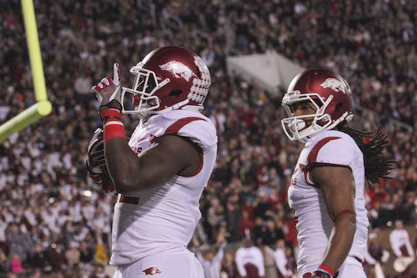 Rawleigh Williams III celebrates in the end zone after scoring one of 4 touchdowns in the first half of the Razorbacks game against Mississippi State in Starkville, MS.