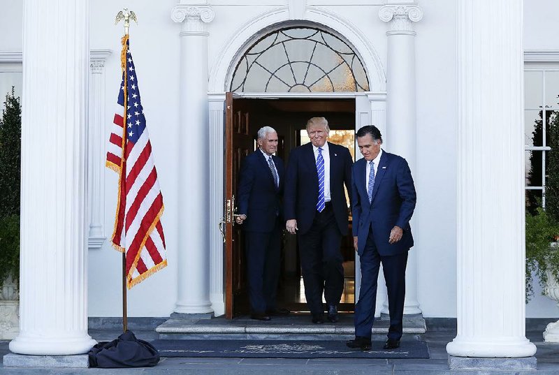 Vice President-elect Mike Pence (from left), President-elect Donald Trump and Mitt Romney step out of the clubhouse at Trump National Golf Club Bedminster in Bedminster, N.J., after talks Saturday