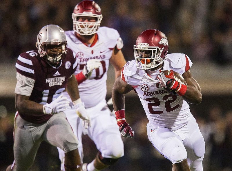 NWA Democrat-Gazette/JASON IVESTER
Arkansas running back Rawleigh Williams (22) breaks away on a carry on Saturday, Nov. 19, 2016, at Davis Wade Stadium in Starkville, Miss., during the second quarter.