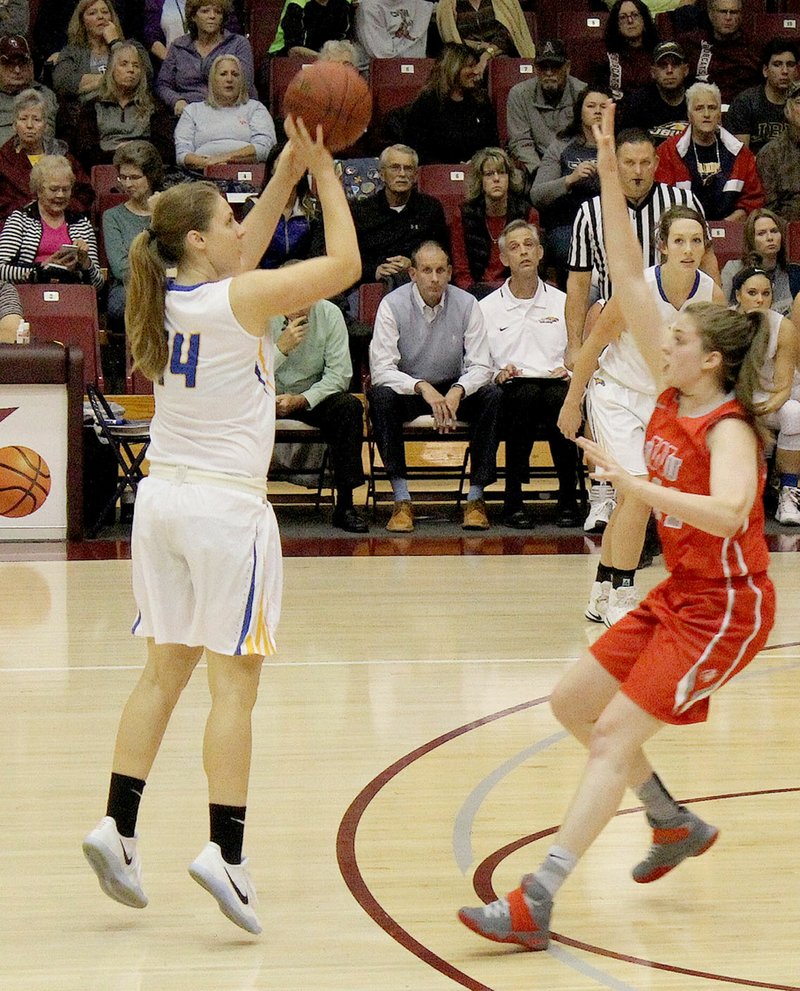 Photo courtesy of College of the Ozarks (Mo.) John Brown University forward Luize Strastina goes up for a shot Friday against Indiana Wesleyan in the Coke Classic held at the College of the Ozarks.