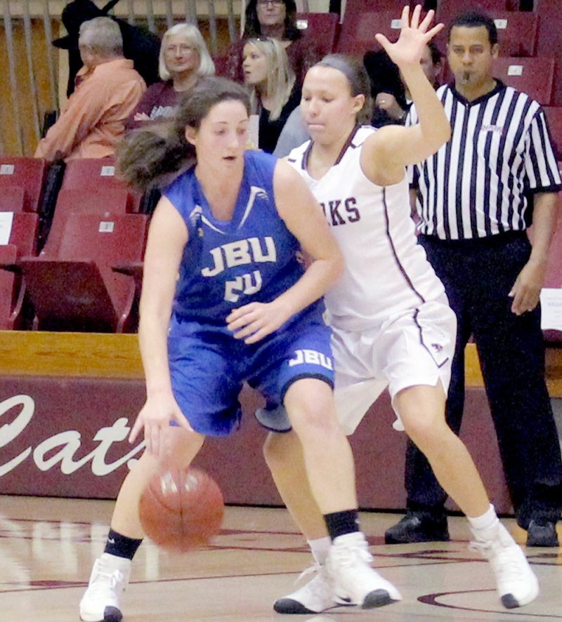 Photo courtesy of College of the Ozarks John Brown University sophomore post Baily Cameron backs her way to the basket Saturday against College of the Ozarks (Mo.).