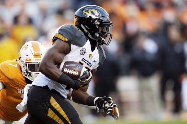 Missouri running back Damarea Crockett (16) runs for yardage as he's chased by Tennessee defensive back Rashaan Gaulden (7) during the first half of an NCAA college football game Saturday, Nov. 19, 2016, in Knoxville, Tenn.