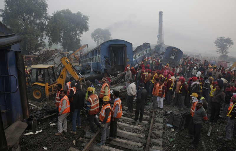 Rescuers work at the site after 14 coaches of an overnight passenger train rolled off the track near Pukhrayan village in Kanpur Dehat district of the northern Indian state of Uttar Pradesh, India, Monday, Nov. 21, 2016. Dozens died and dozens more were injured in the accident. 