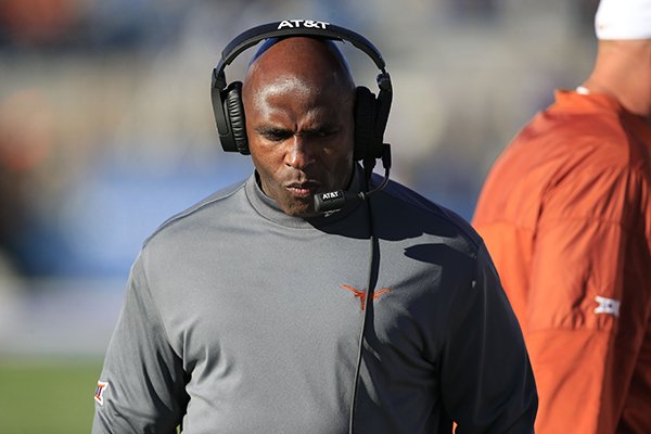 Texas head coach Charlie Strong walks the sideline during the first half of an NCAA college football game against Kansas in Lawrence, Kan., Saturday, Nov. 19, 2016. (AP Photo/Orlin Wagner)

