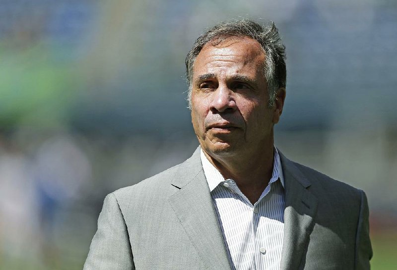 In this July 31, 2016, file photo, Los Angeles Galaxy Bruce Arena walks on the pitch following an MLS soccer match against the Seattle Sounders, in Seattle.