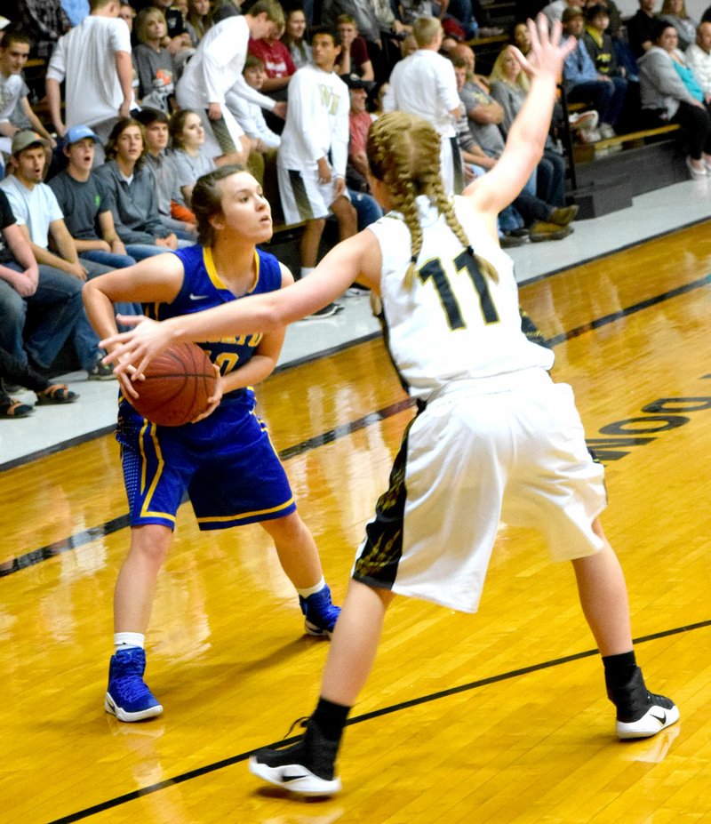 Photo by Mike Eckels Lady Bulldog Meagan Smith (10) tries to find an opening to the basket during Decatur&#8217;s season opener against the Lady Tigers in the Tiger Dome at West Fork Nov. 15.