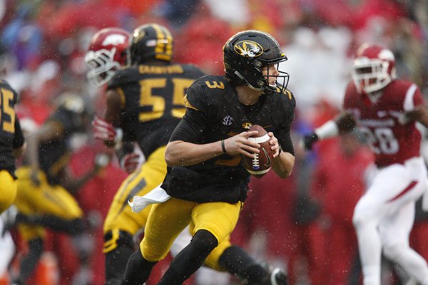 Missouri quarterback Drew Lock looks to pass during a game against Arkansas on Friday, Nov. 27, 2015, in Fayetteville. 