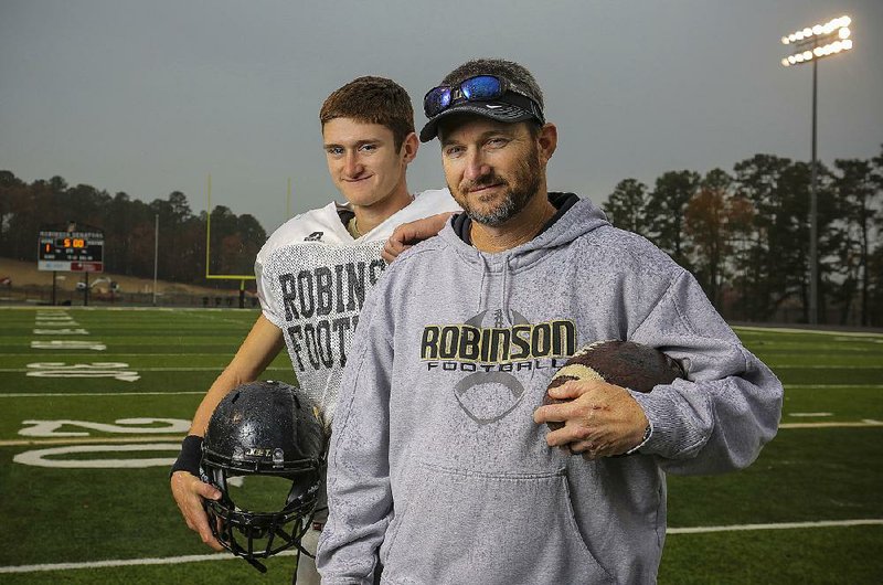 Coach Todd Eskola and his son, senior quarterback Hunter, have helped lead Joe T. Robinson to an 11-1 record and the Class 4A quarterfinals for the first time since 2010. The Senators play at Warren on Friday night.