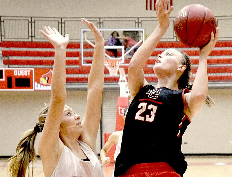 Photo by Rick Peck McDonald County&#8217;s Tricia Wattman shoots over a Webb City defender during a four-team scrimmage held on Nov. 17 at Webb City High School.