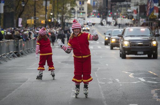 Performers skate along Central Park South before the Macy's Thanksgiving Day Parade, Thursday, Nov. 24, 2016, in New York. 