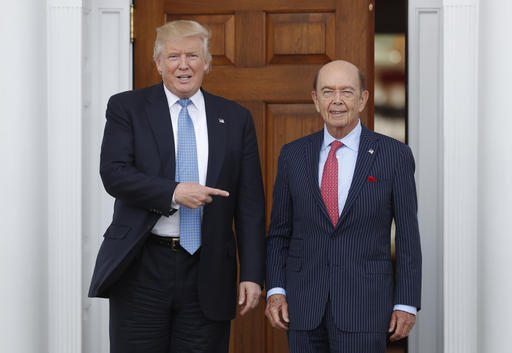 In this Sunday, Nov. 20, 2016, file photo, President-elect Donald Trump, left, stands with investor Wilbur Ross after meeting at the Trump National Golf Club Bedminster clubhouse in Bedminster, N.J. Trump is poised to offer the position of commerce secretary to the head of a private-equity firm, Wilbur Ross. 