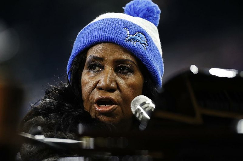 Aretha Franklin rehearses the national anthem during warmups of an NFL football game between the Detroit Lions and the Minnesota Vikings, Thursday, Nov. 24, 2016 in Detroit.