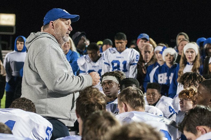 Bryant Coach Buck James (left), in his first year at the school, has led the Hornets to a 9-3 record and a spot in the Class 7A semifi nals against North Little Rock.