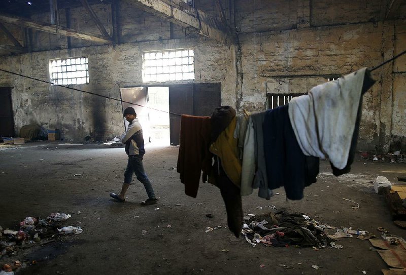 Some migrants blocked from going to EU countries have set up camp in abandoned buildings, like this crumbling warehouse in Belgrade, Serbia.
