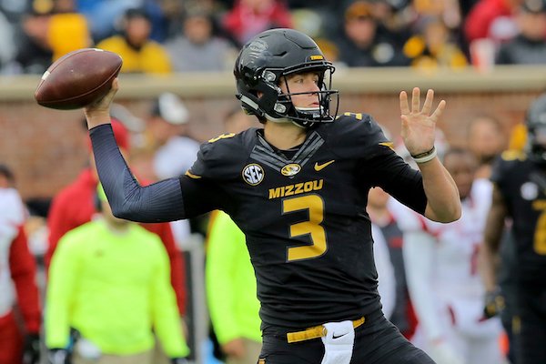 Missouri QB Drew Lock throws in the second quarter during their game Friday in Columbia, Mo.