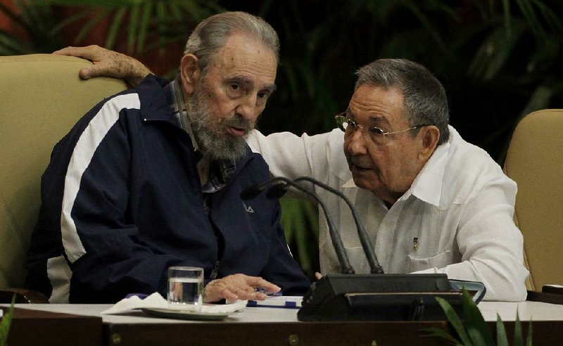 Raul Castro (right) confers with his brother Fidel at a Communist Party Congress in Havana in April 2011