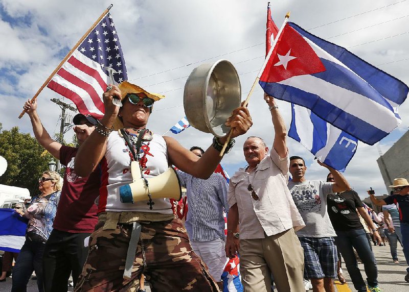 Members of the Cuban community  in Miami’s Little Havana district celebrate Saturday after hearing the news of
Fidel Castro’s death. “There will be many days of celebration,” said Santiago Portal, 84, who left Cuba for Miami half a century ago.