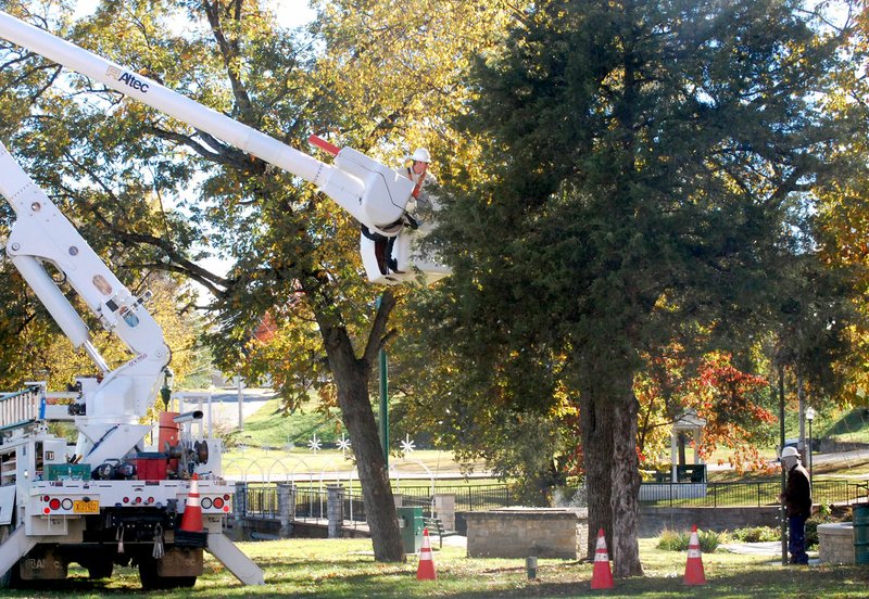 Hayden Williamson/Special to Siloam Sunday City crews worked to hang Christmas lights in Twin Springs Park the week before Thanksgiving. Lights went up throughout downtown and in city parks. They will be turned on during the annual lighting ceremony, which will be held on the steps of the Old Post Office on Broadway Street before the 36th annual Christmas Parade on Dec. 3.