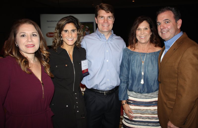 Crystal Vickmark, CASA executive director (from left), Lisa and Bill Mayer and Leslie and Scott Rouse gather at the Light of Hope luncheon Nov. 17 at the Northwest Arkansas Convention Center in Springdale.