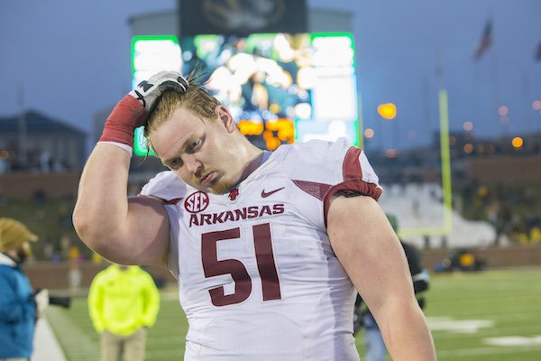 Arkansas offensive lineman Hjalte Froholdt (51) walks off the field on Friday, Nov. 25, 2016, at Faurot Field in Columbia, Mo., following the Razorbacks' 28-24 loss to Missouri.