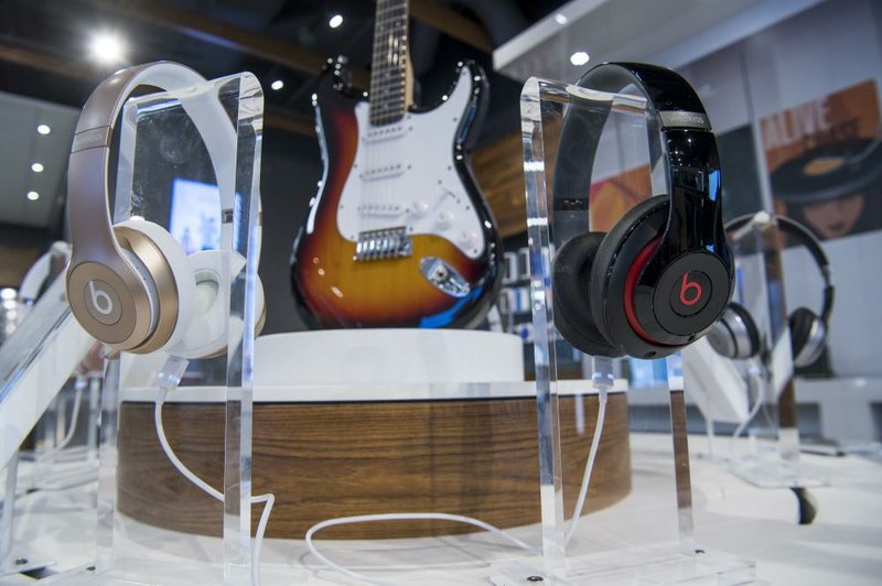 Beats Electronics headphones and a Fender guitar are displayed in the new AT&T Inc. flagship store in San Francisco in September.