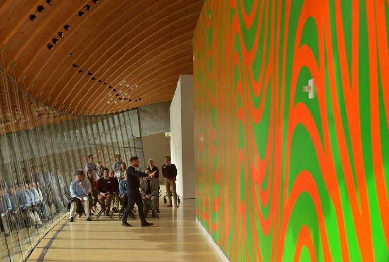 Chad Alligood, a curator at Crystal Bridges Museum of American Art, leads a talk on Nov. 21 about Sol LeWitt’s recently installed Wall Drawing 880: Loopy Doopy at the museum in Bentonville.