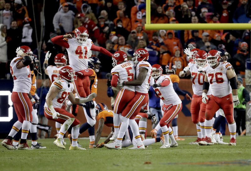 Kansas City Chiefs kicker Cairo Santos (5) celebrates his game winning field goal with teammates during overtime of an NFL football game against the Denver Broncos, Sunday, Nov. 27, 2016, in Denver. The Chiefs won 30-27 in overtime. 