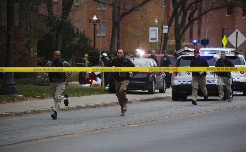 Officers respond Monday after an Ohio State University student attacked pedestrians on the campus in Columbus. The assailant was fatally shot by police.