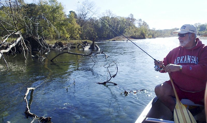 Bob Ross probes the timber along the Elk River in search of smallmouth bass. He was casting with a small, plastic worm.