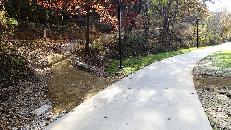 Several trail intersections at Lake Atalanta Park let bike riders switch from hard to soft surface trails.