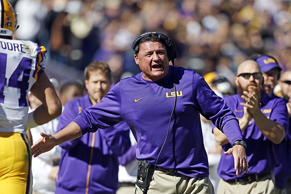 LSU interim head coach Ed Orgeron cheers from the sideline after a score in the first half an NCAA college football game against Florida in Baton Rouge, La., Saturday, Nov. 19, 2016. Florida won 16-10. (AP Photo/Gerald Herbert)

