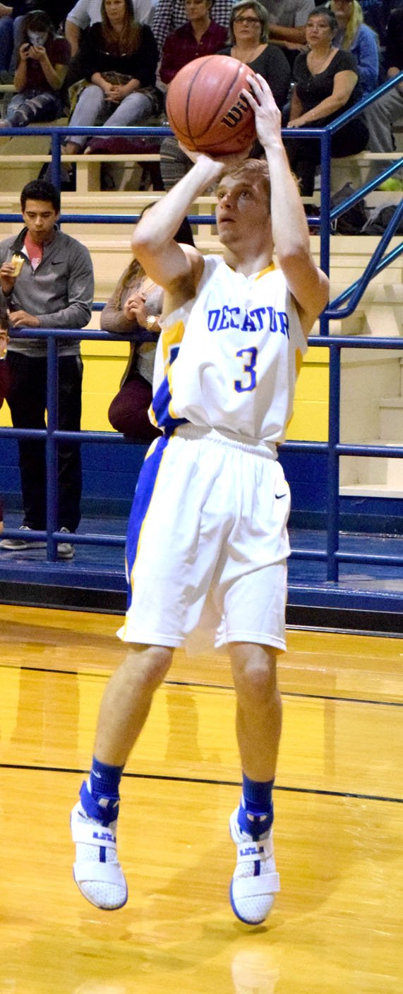 Photo by Mike Eckels Decatur&#8217;s Taylor Haisman puts up a long jumper from the wing during the Bulldog-Pioneer basketball game at Peterson Gym in Decatur Nov. 22. Haisman was the leading scorer for the Bulldogs, with 25, which included five three-point shots for his second straight game over 20 points.